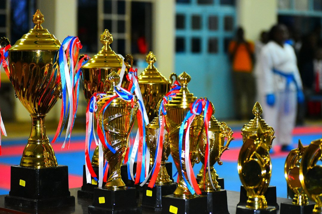 Golden trophies shining on a stage, symbolising the Ballon d'Or 2026 awards