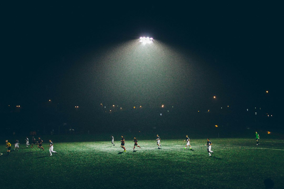 Football stadium at night under floodlights on a Champions League match night